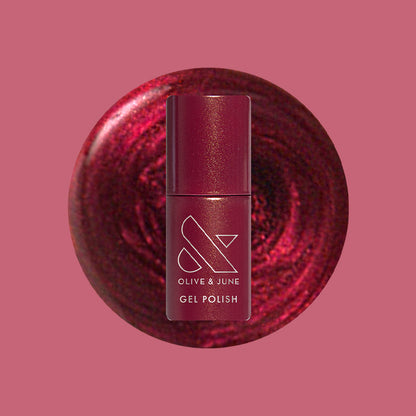 Budget? What Budget Gel deep rose-orange duochrome gel polish bottle with swirled polish background for manicure by Olive and June
