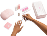 The Gel Mani System + Builder Gel Kit - 6 showing a hand applying gel polish with lamp, nail care tools, and packaging visible