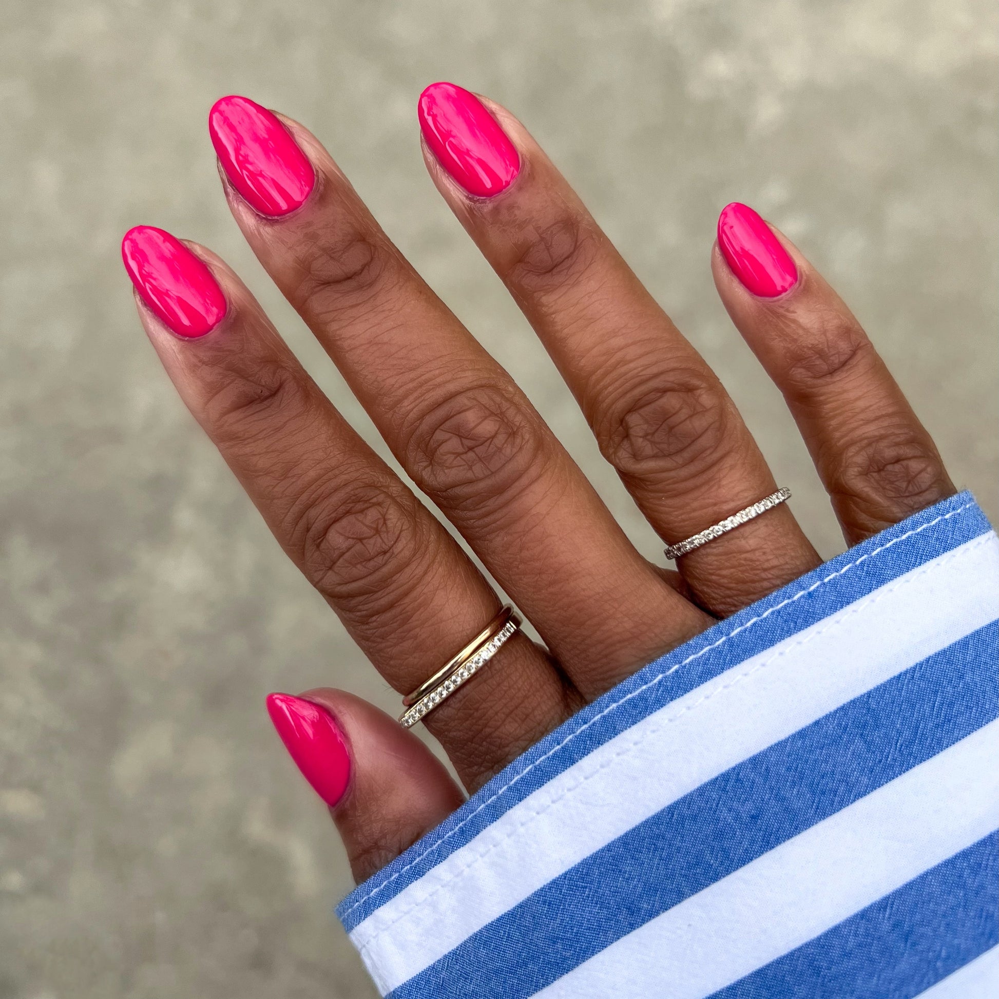 Diner Date bright hot pink gel polish on natural nails with a smooth glossy finish for a vibrant manicure
