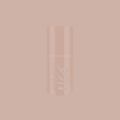 Bottle of CDJ - Gel nail polish by Olive and June in creamy neutral shade on matching soft background