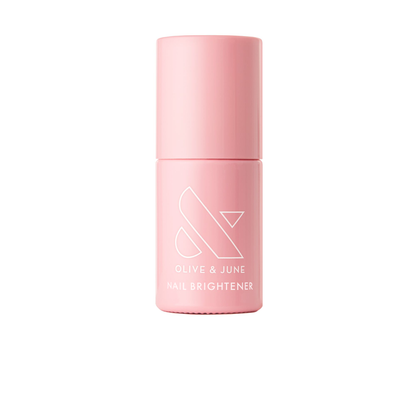 Pink bottle of The Nail Brightener by Olive and June designed to illuminate stained nails with a shimmery finish