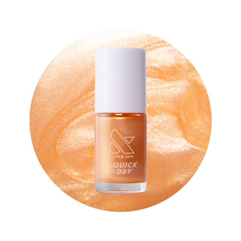 Bottle of Sunlit warm golden peach shimmer quick dry gel polish by Olive and June on peach shimmer background