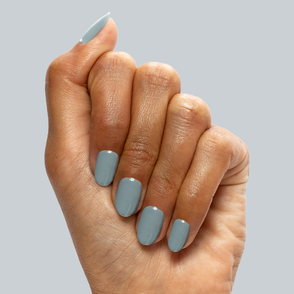 Vintage - Gel shown on hand with smooth denim blue nails for a stylish and long-lasting gel manicure by Olive and June